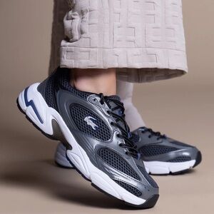 Lacoste Mens Storm 96 2K Synthetic
Leather Sneakers / Dark Gray and Navy